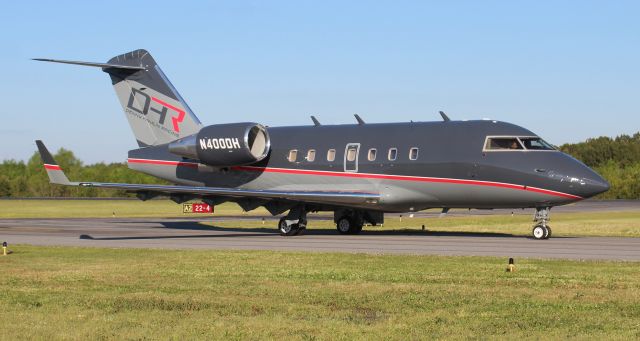 Canadair Challenger (N400DH) - Denny Hamlin Racing's 1998 model Canadair Challenger 601-3A taxiing at Boswell Field, Talladega Municipal Airport, AL, after the NASCAR GEICO 500 race at Talladega Super Speedway - late afternoon, April 25, 2021.