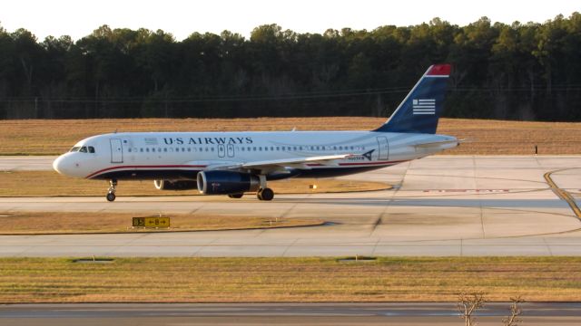 Airbus A320 (N669AW) - An American Airlines (US Airways livery) landing at Raleigh-Durham Intl. Airport. This was taken from the observation deck on January 17, 2016 at 4:52 PM. This is flight 2056 from CLT.