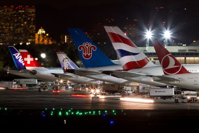 BOEING 777-300 (TC-JJL) - Here we see a good mix of European and Asian carriers at the relatively new Tom Bradley International terminal.  A fitting background too are the high-rise buildings located in Century City some 10 miles north of LAX. Local time is now 18:45 PST,  taken on 1-6-2015.