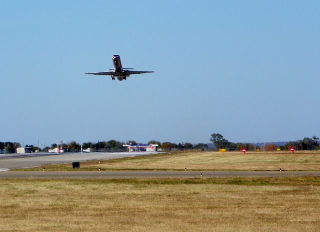 — — - Standing on berm at the south end of the runway looking north.
