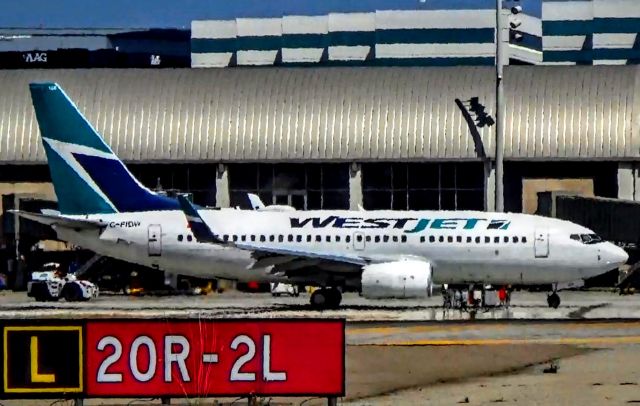 Boeing 737-700 (C-FIBW) - Preparing for a flight back to Vancouver.