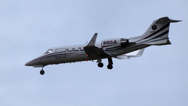 Learjet 31 (N103JL) - On final is this 1990 Learjet 31 configured for Medevac duty in the Winter of 2019. On the winglet is a single electro-cardiograph pulse. Nice touch as the twin jet engines are pulsing perfectly. 