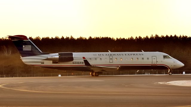 Canadair Regional Jet CRJ-200 (N446AW) - Awaiting clearance on Rwy 25 for the early morning departure to CLT/KCLT.