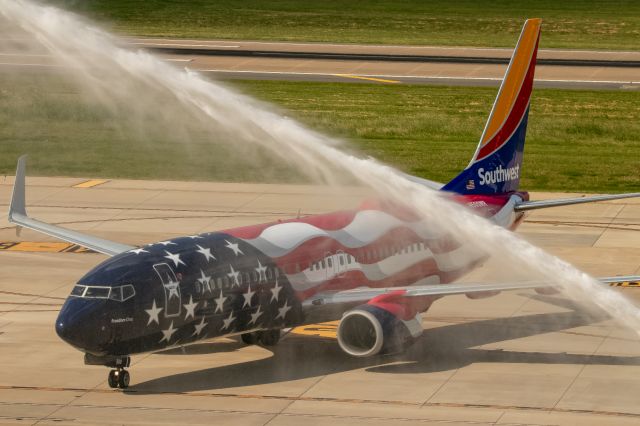 Boeing 737-800 (N500WR) - Freedom One receiving a Water Canon Salute upon arrival into KDAL.