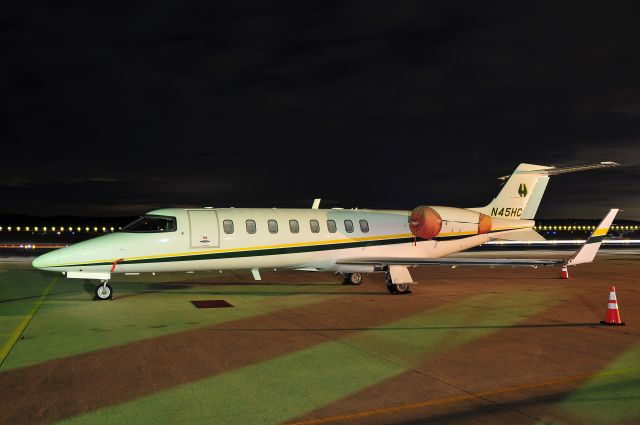 Learjet 45 (N45HC) - Seen at KFDK on 9/22/2009.  Dotted lights in background created by the strobe-light on a security vehicle.    a href=http://discussions.flightaware.com/profile.php?mode=viewprofile&u=269247  [ concord977 profile ]/a