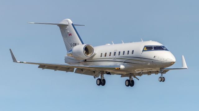 Canadair Challenger (C-GWLL) - Bombardier CL-600-2B16 Series 604 registered to I.M.P.Group Limited. On short finals for runway 23 at YYZ