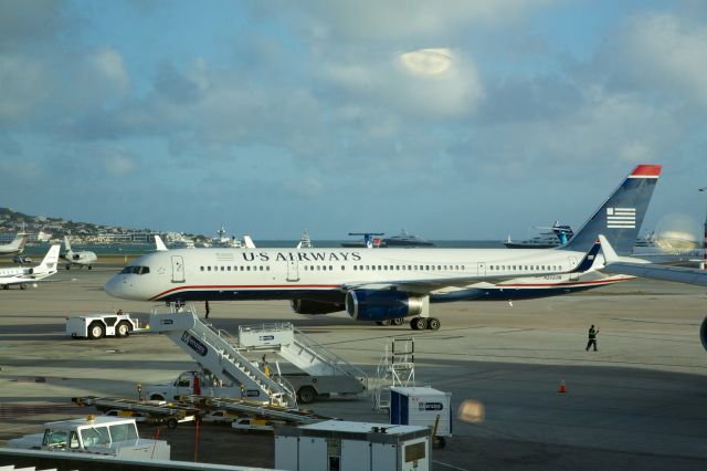 Boeing 757-200 (N202UW) - Boeing 757-2B7 pushes back for departure from SInt Maarten - Jan 6, 2013