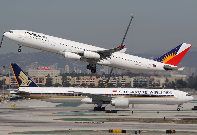 Airbus A340-300 (RP-C3436) - Philippine Airlines - Airbus A340-313 (RP-C3436) takes off from LAX while Singapore Airlines Boeing 777-312(ER) (9V-SWD) taxiing after landing.