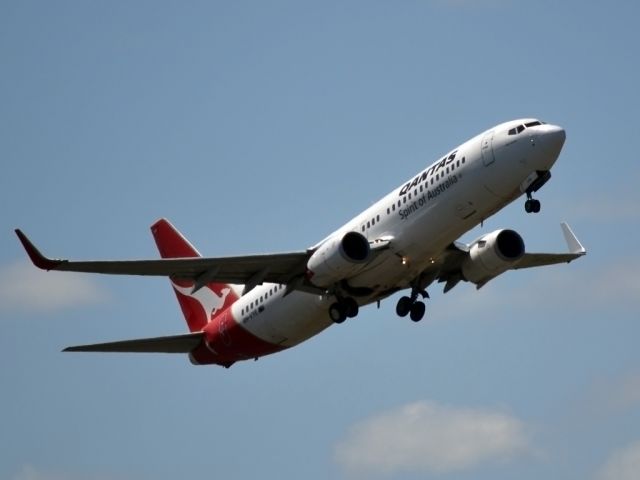 Boeing 737-800 (VH-VYE) - Getting airborne off runway 23.