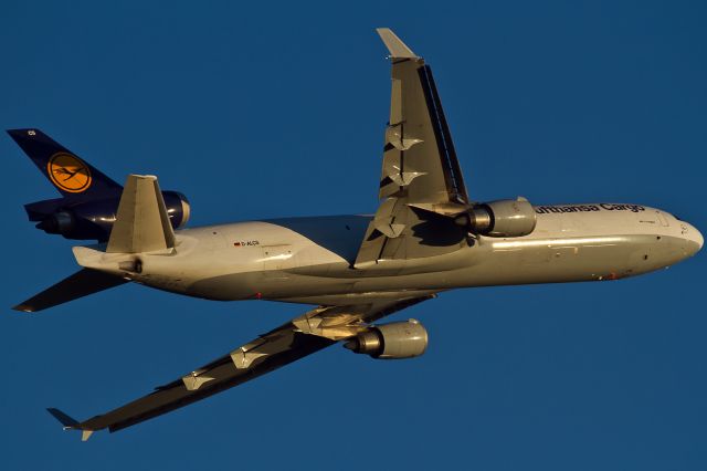 Boeing MD-11 (D-ALCS) - left turn, red evening sun