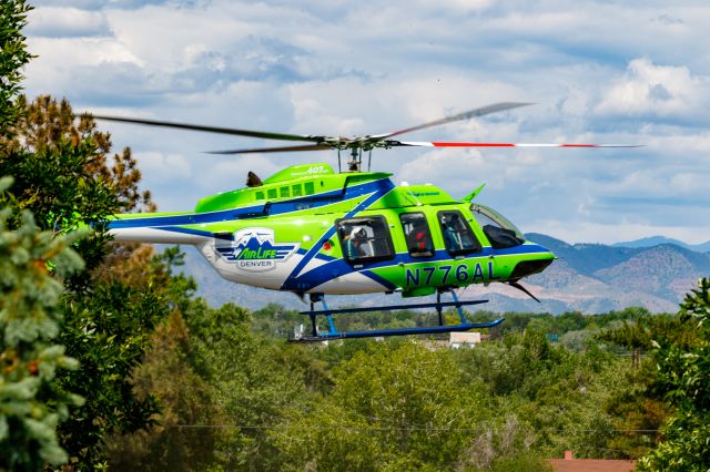 Bell 407 (N776AL) - Landing at Arapahoe Community College in Littleton, CO for a public relations show and tell.