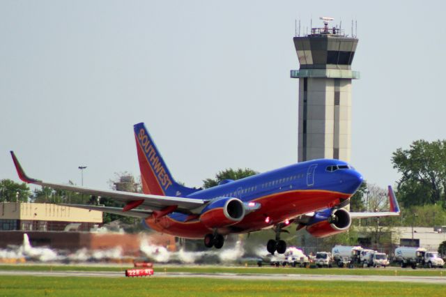 — — - Southwest 737 lifting off of 31C at Chicago Midway, June 2014.