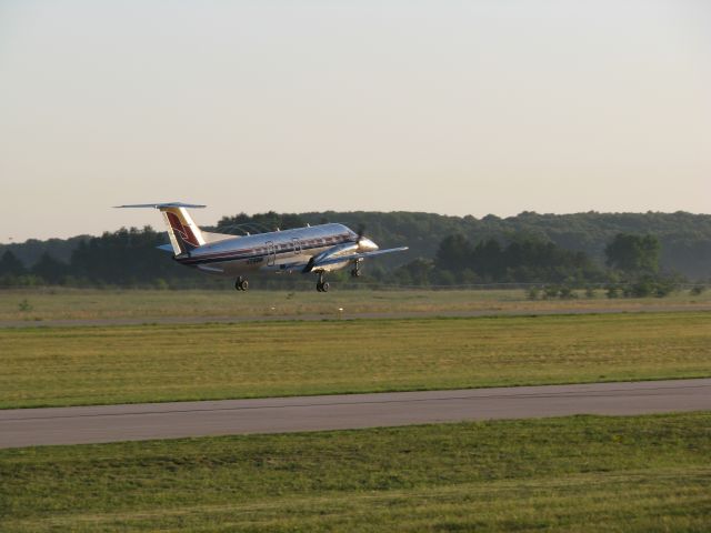 Embraer EMB-120 Brasilia (N597M) - Menards departing runway 4, note the spirals off the props.