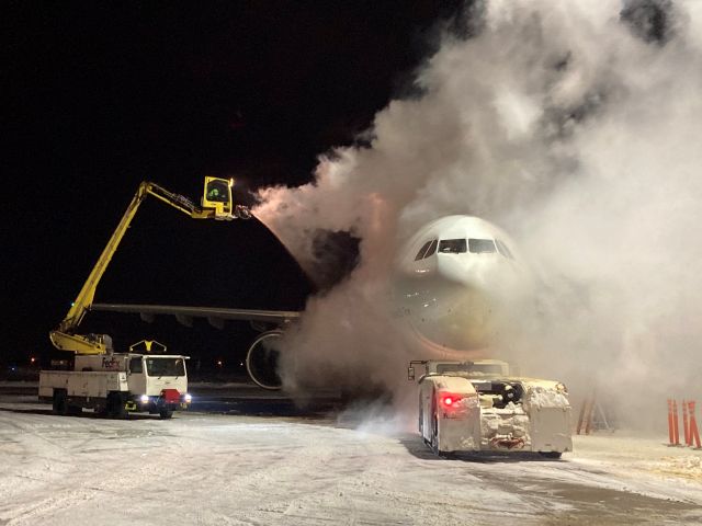 Airbus A300F4-600 (N744FD) - FedEx Flight 325 in the process of getting the ice & snow removed for safe flight. 