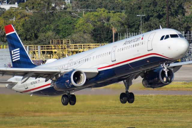 Airbus A321 (N578UW) - U.S. Airways Heritage livery departing Runway 19L at the Tampa International Airport as AA2479 for Charlotte (CLT)br /br /• Delivered to USAirways - MAR 2014br /• Joined America Airlines fleet - APR 2014br /• Painted USAirways heritage livery - APR 2014br /• Configured 16 First Class / 171 Economy