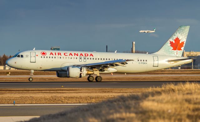 Airbus A320 (C-FGKH) - AC423 arrives from Montreal. A Westjet 738 on short finals for the 06s in the background!br /April 8th, 2018