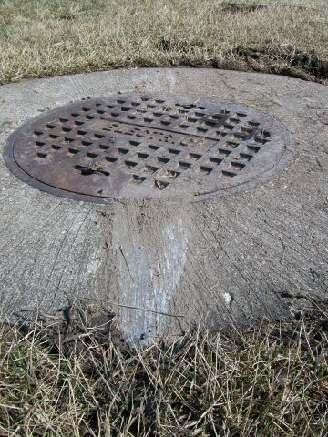 Cessna Commuter (N18040) - The spinner ground across this cement slab.