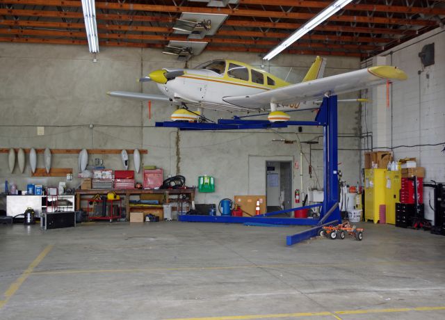 Piper Cherokee — - GREENWOOD LAKE AIRPORT, WEST MILFORD, NEW JERSEY, USA-JUNE 11, 2023: Seen by RF at the 2023 Greenwood Lake Air Show was this Piper Cherokee in the hangar for some maintenance.