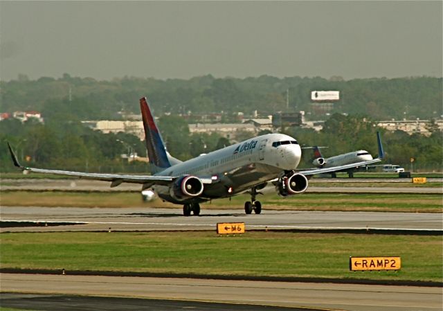 Boeing 737-800 (N3756) - formation flying... at Katl... side by side.. landing and take offs. going on all day long.