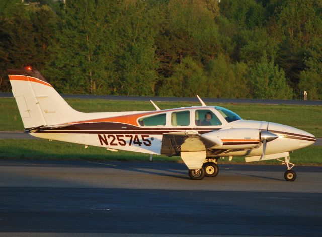 Beechcraft 55 Baron (N24575) - Taxiing to runway 2 at KJQF - 4/17/11