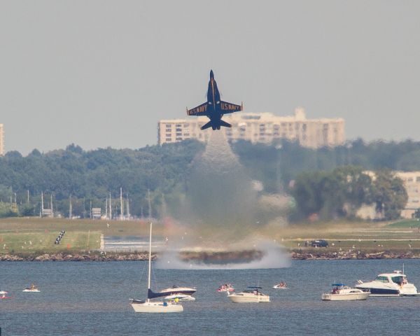 — — - Blue Angel #6 pulls up hard just past the end of the runway and over Lake Erie as he departs Burke Lakefront airport during a practice prior to the Cleveland National Air Show over Labor Day weekend, 2014.