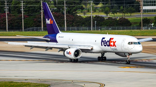 Boeing 757-200 (N954FD) - "Mika" departing 36L via the high-speed turn off. Originally G-CPER with British Airways, and delivered in the ethnic "Wings" tail design in 1997.