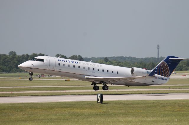 Canadair Regional Jet CRJ-200 (N418AW) - United aircraft flying into Grand Rapids. Picture taken from observation area.