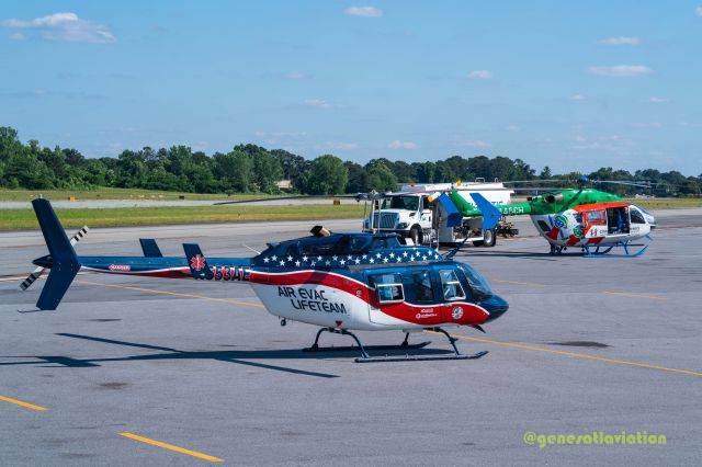 N553AE — - Two air medivac helicopters preparing to take off. N553AE is closest to the camera. N445CH in the background. 