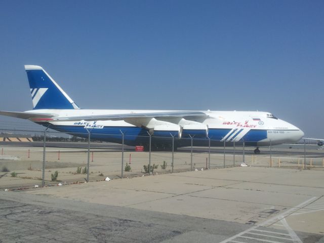 DAH124100 — - Saw this at Ontario, CA while waiting in the cell phone lot.  It was bigger than the 747-200 seen at the left just off the nose (51 ft wider wingspan!  5 ft shorter in length.  Remarkable aircraft.