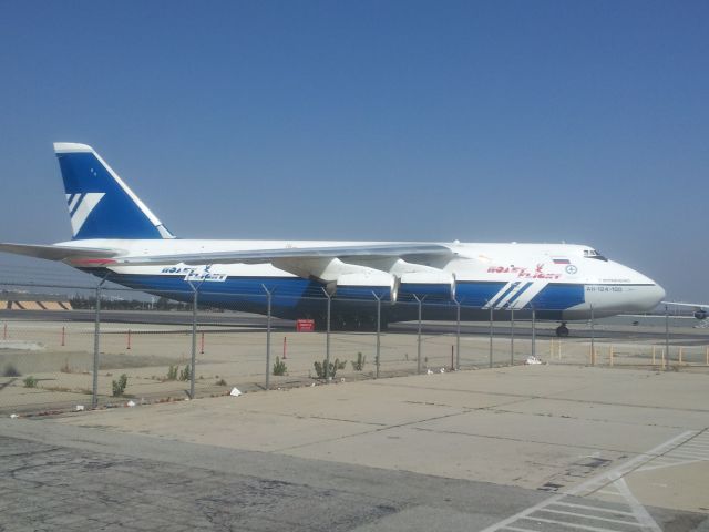 DAH124100 — - Saw this at Ontario, CA while waiting in the cell phone lot.  It was bigger than the 747-200 seen at the left just off the nose (51 ft wider wingspan!  5 ft shorter in length.  Remarkable aircraft.