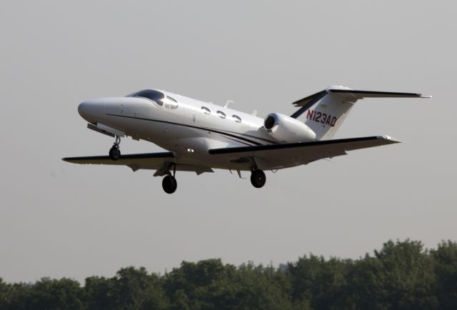 Cessna Citation Mustang (N123AD) - Take off RW26.