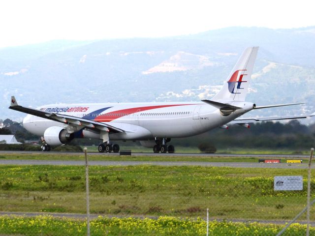 Airbus A330-300 (9M-MTC) - Rolling for take off on runway 05, for flight home to Kuala Lumpur, just before the arrival of a rain storm. Thursday 12th July 2012.