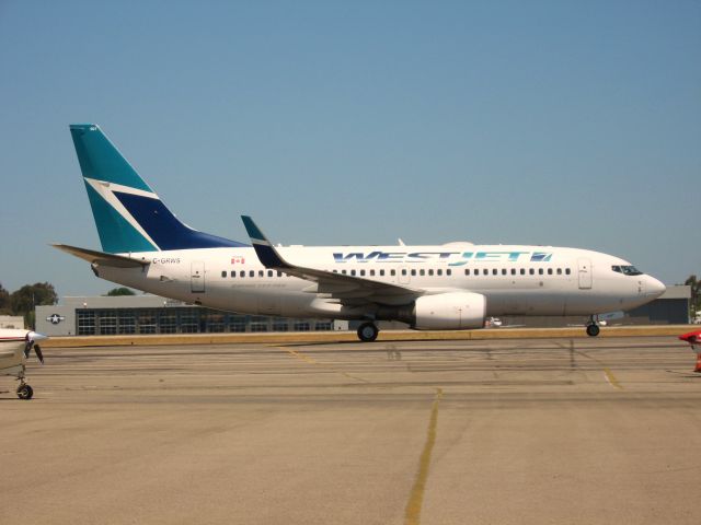 Boeing 737-700 (C-GRWS) - TAXIING TO GATE AFTER LANDING