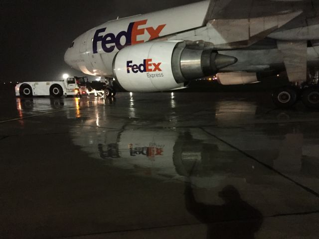 Airbus A300F4-600 (N660FE) - FedEx Airbus A300- 6F "Zack" being pushed back on a very rainy fall night.br /br /The Wing Walker's Shadow can be seen in the lower corner of photo.