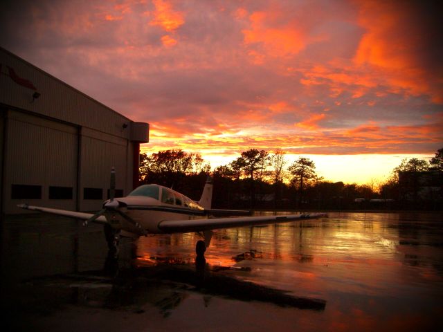 Beechcraft Bonanza (36) (N3084Z) - After thunderstorm, cold front passage and sunset at the FRG hangar NOV 2013