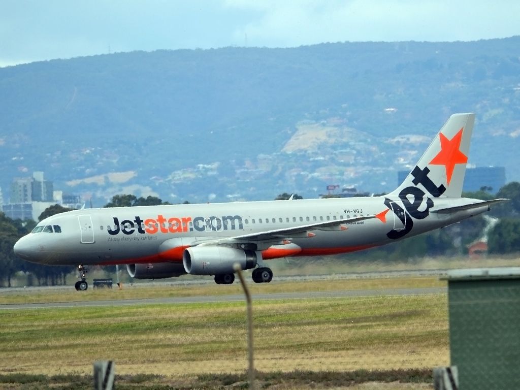 Airbus A320 (VH-VGJ) - On taxi-way heading for Terminal 1 after landing on runway 23. Tuesday 27th December 2011.