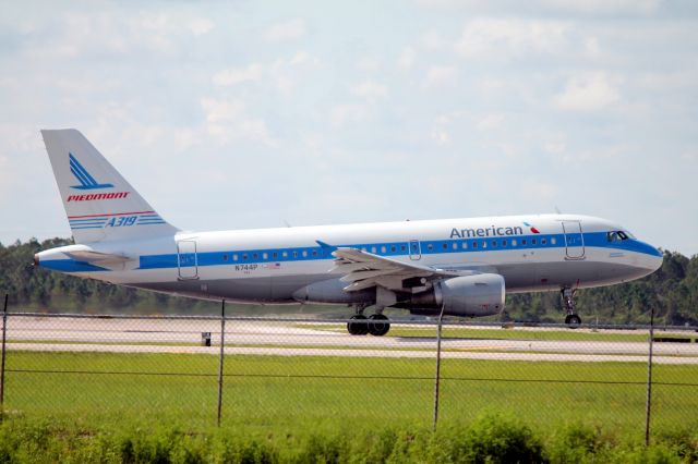 Airbus A319 (N744P) - American Flight 1849 (N744P) "Piedmont Heritage" departs Southwest Florida International Airport enroute to Charlotte-Douglas International Airport