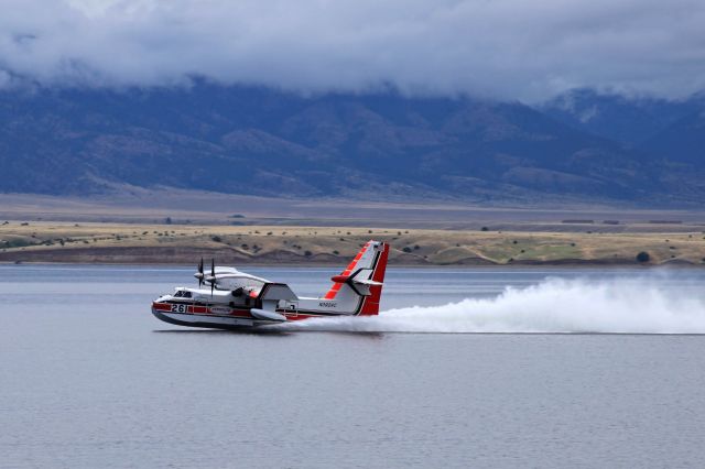 Canadair CL-41 Tutor (N392AC) - Bombardier CL-415 Super Scooper picking up a load of water from Canyon Ferry Lake, MT to fight the Matt Staff Road wildfire.