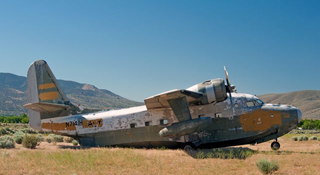 N7141H — - Side view of an albatross on the north side of Carson City Airport waiting for rejuvenation.