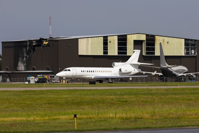 Dassault Falcon 8X (N1S) - Falcon one sierra taxing past is hanger and VP-BBW, both of which hanger in the Sky B&B hanger. The hanger and Falcon N908CA were severely damaged on June 30th, 2019 when King Air N534FF crashed on takeoff killing all ten. 