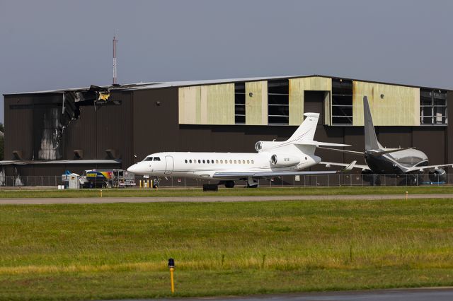 Dassault Falcon 8X (N1S) - Falcon one sierra taxing past is hanger and VP-BBW, both of which hanger in the Sky B&B hanger. The hanger and Falcon N908CA were severely damaged on June 30th, 2019 when King Air N534FF crashed on takeoff killing all ten. 