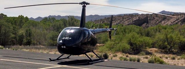 Robinson R-44 (N4204X) - N4204X parked after flying from KTUS to E67