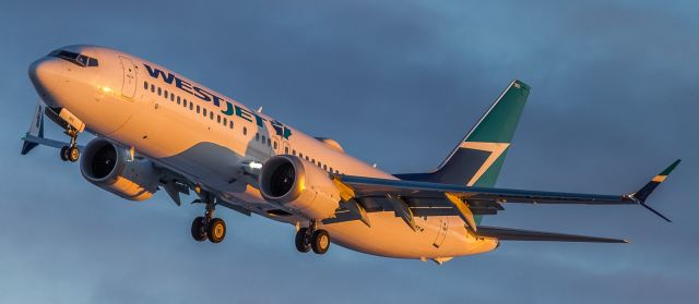 Boeing 737 MAX 8 (C-GXAX) - A Westjet MAX-8 lines up for runway 23 at sunrise