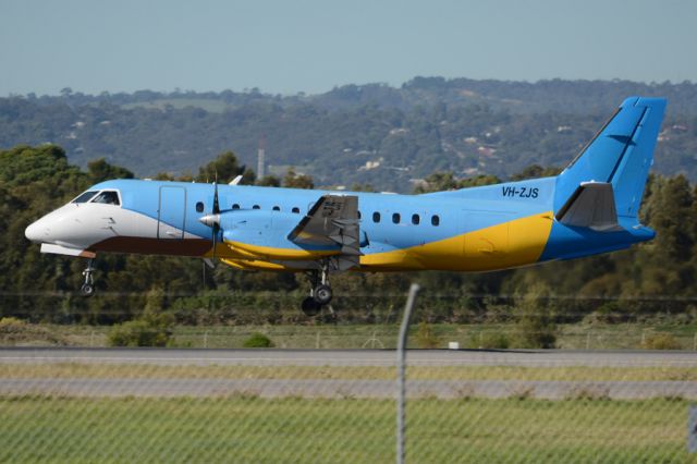 Saab 340 (VH-ZJS) - About to put down on runway 05. Wednesday, 21st May 2014.