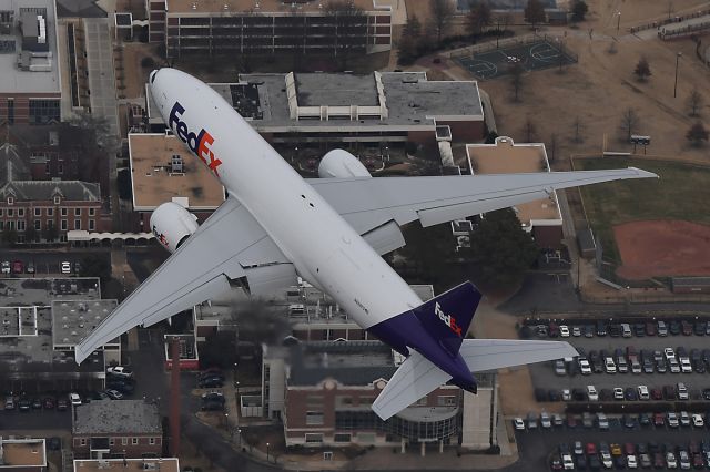 — — - Fed Ex 777 flying over Christian Brothers University in Memphis TN