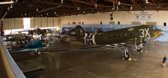 Douglas DC-3 (N74TB) - TAB standing guard in the hangar. 