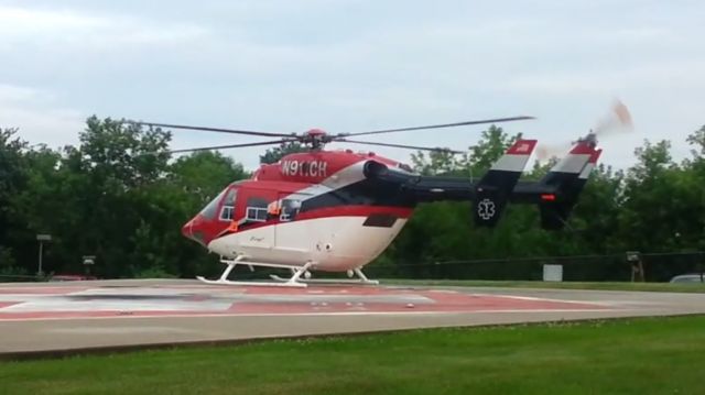 NUSANTARA NBK-117 (N911CH) - N911CH (1990 MBB BK117 B1, C/N 7223) lifting off from Central Maine Medical Center on Wednesday 8/6/2014