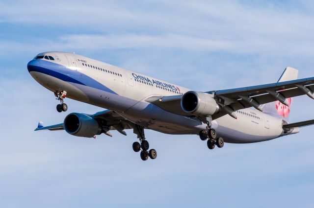 Airbus A330-300 (B-18357) - China Airlines flight CAL57 from Melbourne in the final 150ft of the approach to land on Runway 02 at Christchurch Airport on 5 March 2016 at 6:30pm. Photographed with my 300mm telephoto lens from the side of Pound Rd looking south.