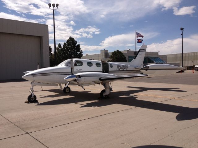 Cessna 340 (N340RF) - At DIA waiting to fix a flat tire.