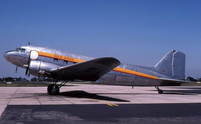 Douglas DC-3 (VH-SBL) - Dc3 VH-SBL in the colors of short lived company Gold Wings at Melbourne Essendon Airport